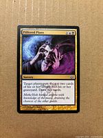 Front of Pilfered Plans card showing artwork, gold promo border and text