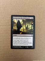 Front of Rescue from the Underworld card on cardboard background