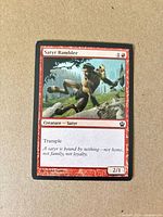 Front of Satyr Rambler card showing art, text, mana cost, set symbol