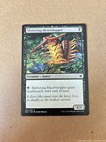 Front of Skittering Heartstopper card showing artwork, set code and stats