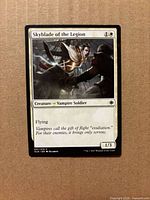 Front view of Skyblade of the Legion card displaying name, mana cost, artwork, type line, text box, set code 037/279, power/toughness 1/3.