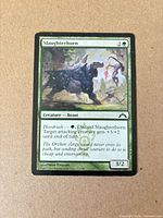 Front of Slaughterhorn card showing title, mana cost, artwork, text box, power/toughness