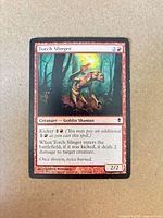 Front view of Torch Slinger card showing artwork, mana cost, type line, text box, power/toughness
