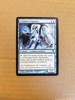 Front of Vedalken Engineer card showing artwork, title, mana cost and stats