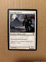 Front of Midnight Duelist card showing artwork, title, mana symbol, text box and power/toughness