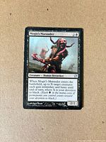 Front of Mogis's Marauder card displaying art, mana cost and text
