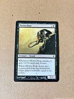 Front of Mortis Dogs card showing name, mana cost 3B, artwork, type line Creature — Hound, text, power/toughness 2/2, collector number 66/175