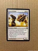 Front of Silent Artisan card showing artwork, mana cost, text box, and condition details
