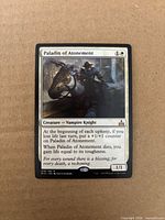 Front of Paladin of Atonement card showing artwork, mana cost, text and rarity