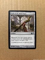 Front of Staff of the Wild Magus card showing artwork, title, set symbol, and overall condition