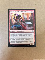 Front of Storm Fleet Swashbuckler card showing artwork, mana cost, rarity symbol