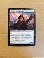 Front of Vicious Conquistador card showing art, set symbol, text box and collector number