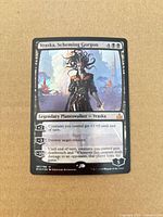 Front view showing card name, art, foil shine, set info