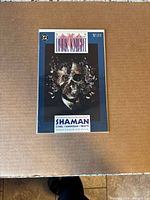 Front view of Batman: Legends of the Dark Knight #4 in protective sleeve on flat surface