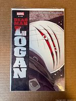 Front cover of Dead Man Logan #2 comic in protective sleeve