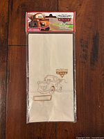 Front view of sealed pack showing Tow Mater graphic and header card