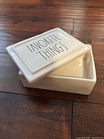 Open trinket box showing lid with text and interior