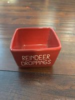 front view of red square dish with text visible
