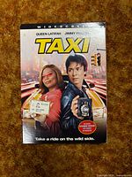 Front of Taxi DVD cardboard slipcover