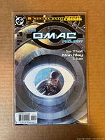 Front cover of The OMAC Project #1 comic book in protective bag with backing board