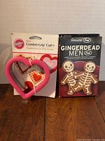 Lot overview showing both packaged cookie cutters