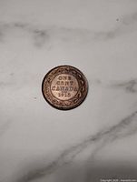 Reverse showing ONE CENT CANADA 1915 with wreath border