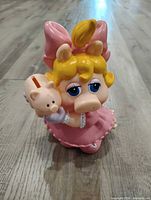 Front view of Miss Piggy vinyl coin bank