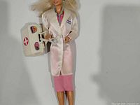 Doctor Barbie full view holding medical bag, showing outfit and accessories