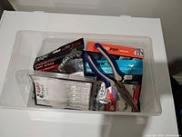 Overview of bin with tackle packs and pliers