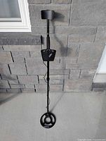 Full view of Discovery 2200 metal detector standing upright showing shaft, control box, armrest, search coil