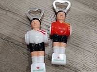 Both foosball player bottle openers front view