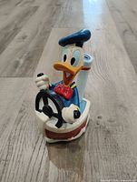 Front view of Donald Duck ceramic coin bank steering wheel