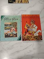 Front view of both Kama Sutra books side by side
