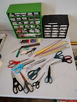 Full lot showing drawer cabinets, scissors, knitting needles and small tools