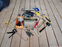 All tools laid out on wood floor