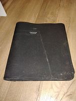 Front view of closed Five Star black zip binder