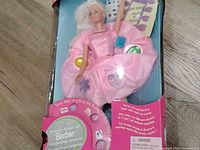 Front view of boxed Twirlin' Make-Up Barbie showing doll, accessories, and packaging graphics