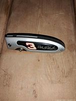 Closed knife showing Dale Earnhardt signature and number 3 on handle