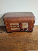 Front view of Philco tabletop radio on wooden surface