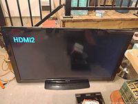Front view of Philips TV powered on showing HDMI2 input