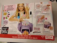 Front of sealed Project Mc2 H2O Nail Science Kit box showing contents and features