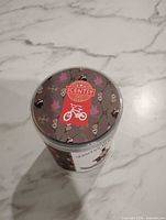 Top view of cylindrical container lid with Scentsy branding