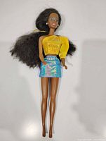Full view of Barbie doll with outfit