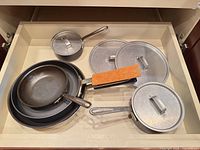 Drawer view showing all cookware pieces nested together