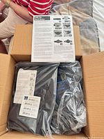Box containing sealed knee brace package and instruction sheet