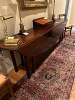 Full view of table with leaves down, dark mahogany finish