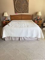Front view of bed showing headboard, mattress, and box springs