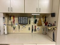 Overall pegboard view with tools, parts organizer, screwdriver rack