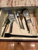 Drawer view showing full assortment of utensils