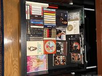 Drawer showing entire assortment of CDs and cassettes